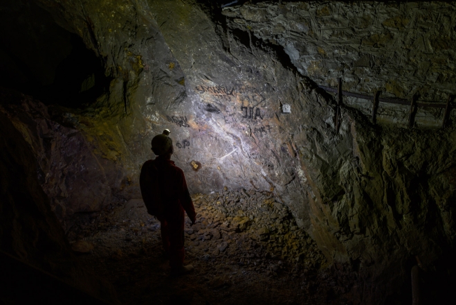 inspecting the grafiti made by the miners
